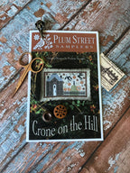 PLUM STREET SAMPLERS "Crone On The Hill"  Counted Cross Stitch Pattern  Autumn,, Fall, Pumpkins, Paper Pattern