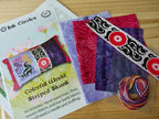 INK CIRCLES "Striped Skunk **Kit**" Counted Cross Stitch Pattern, Kit Includes Linen, DMC Floss, Batiks, and Ribbon, Chart, Pattern Only